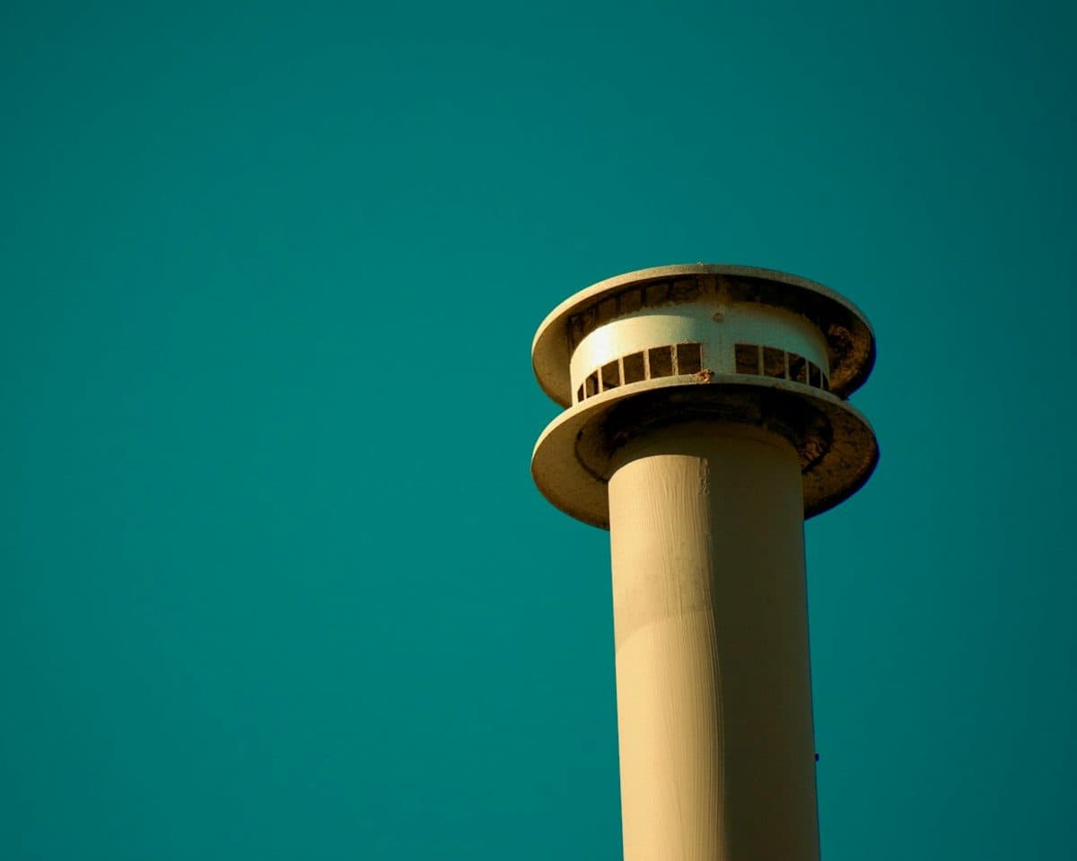 Airport control tower against a clear sky