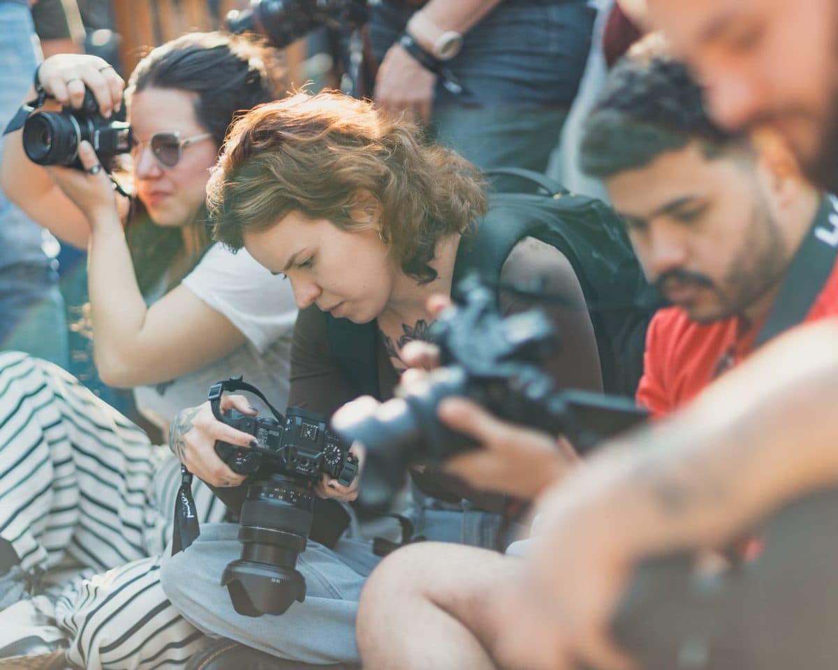 Production crew with cameras working at an outdoor event